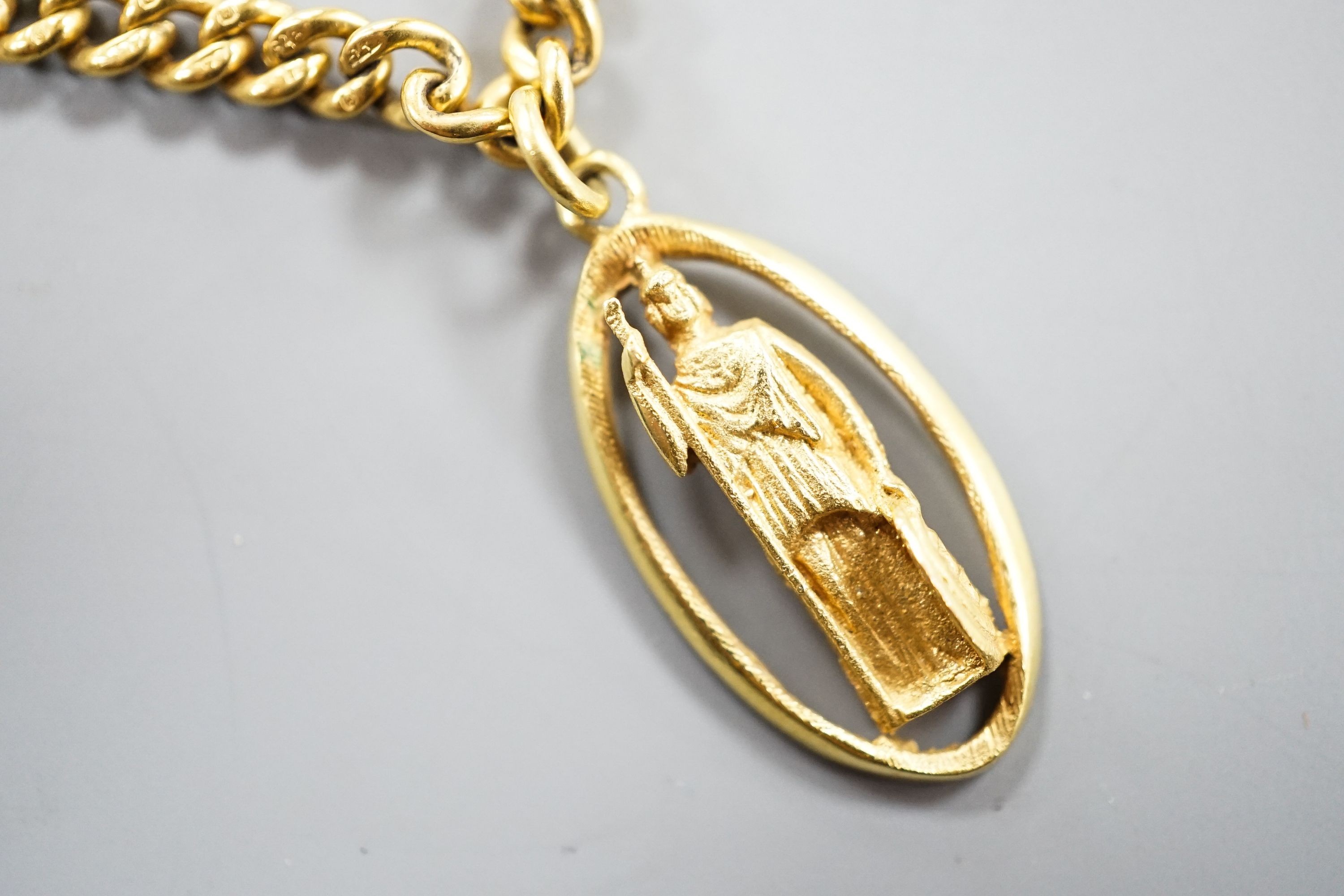 A 9ct curb link chain, 44cm, 15.7 grams, with a yellow metal St. Christopher pendant, engraved '18', 2.5 grams.